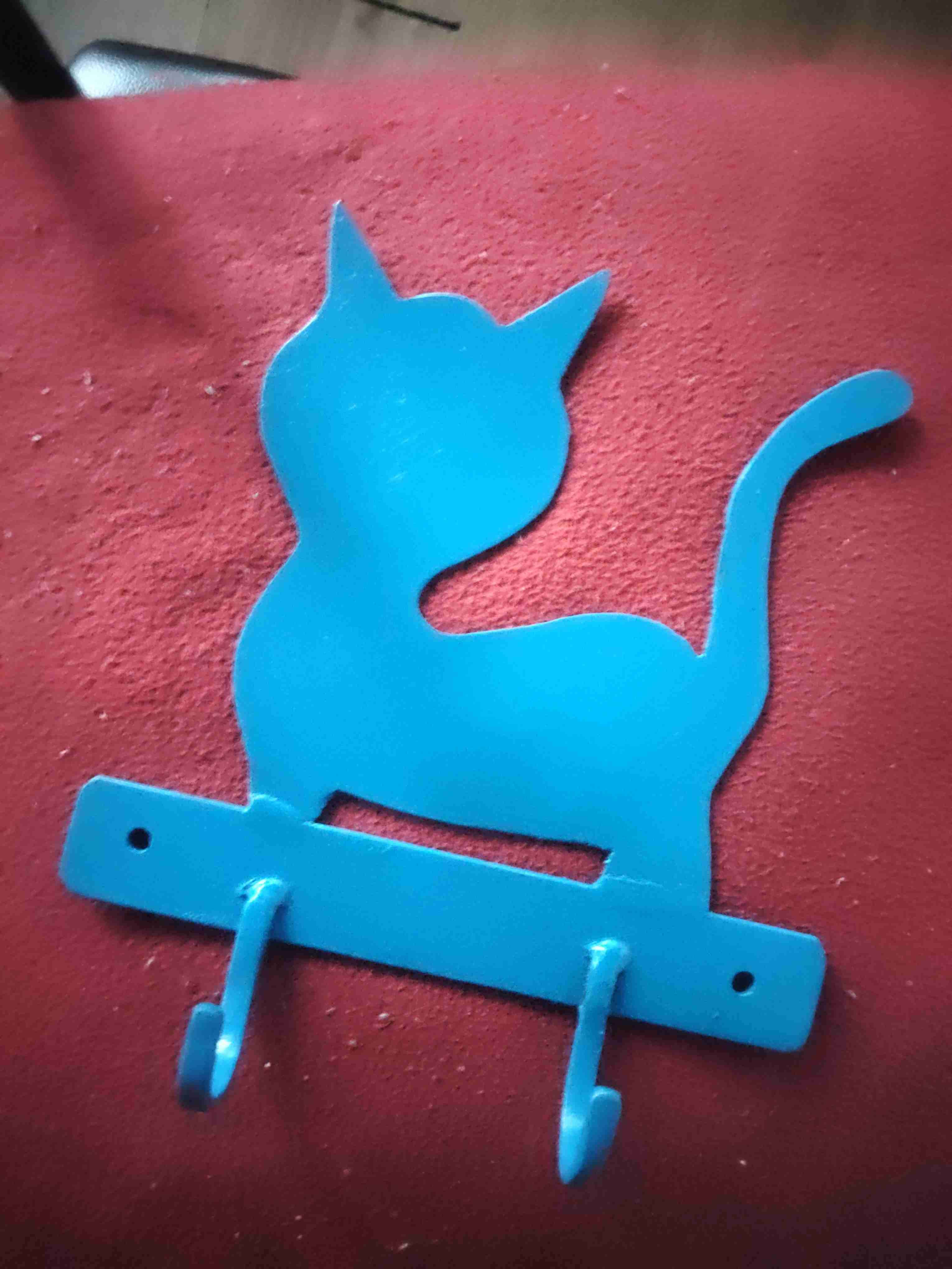 Colgador azul de gato