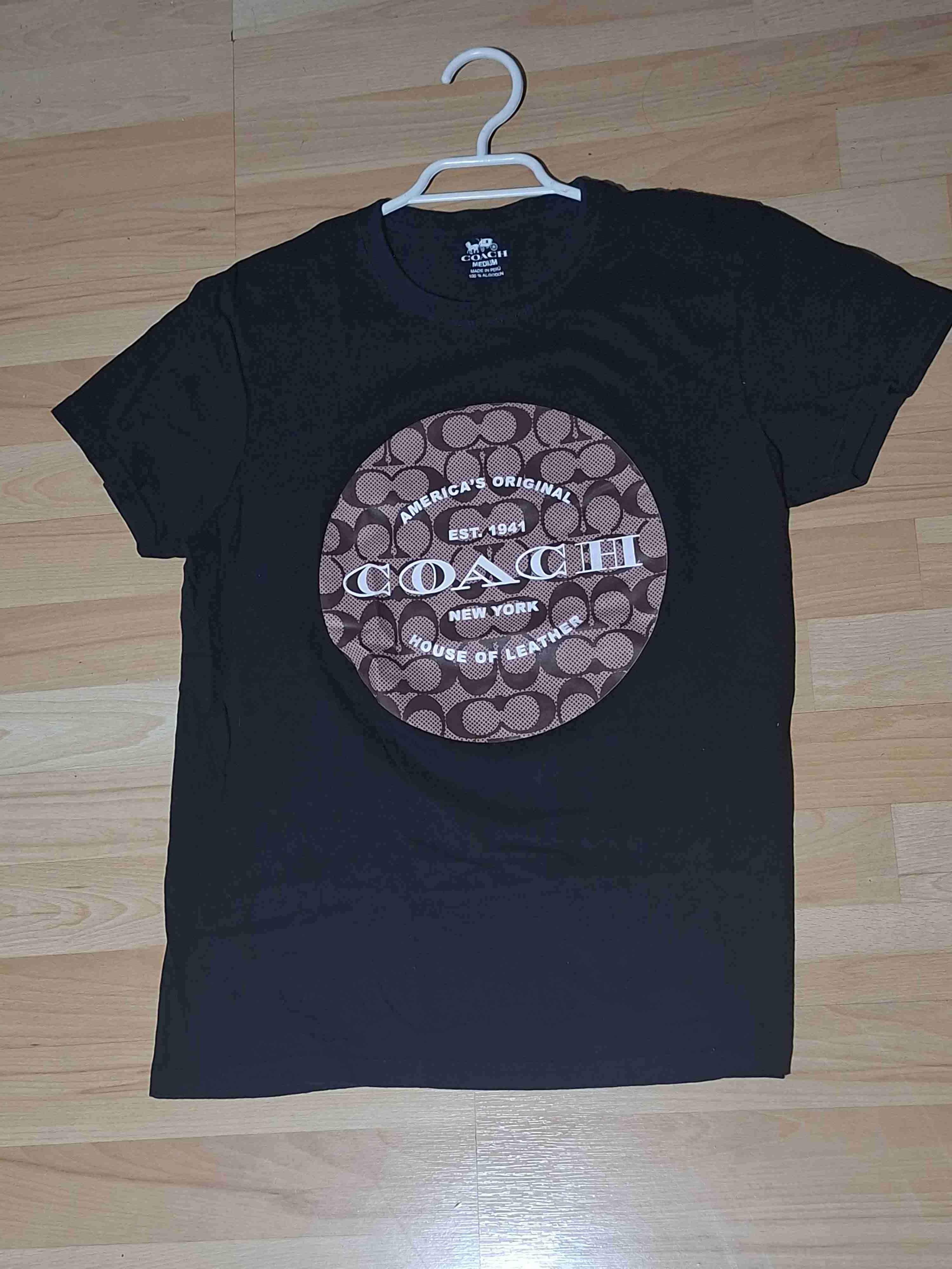 Polera negra Coach estampada talla M
