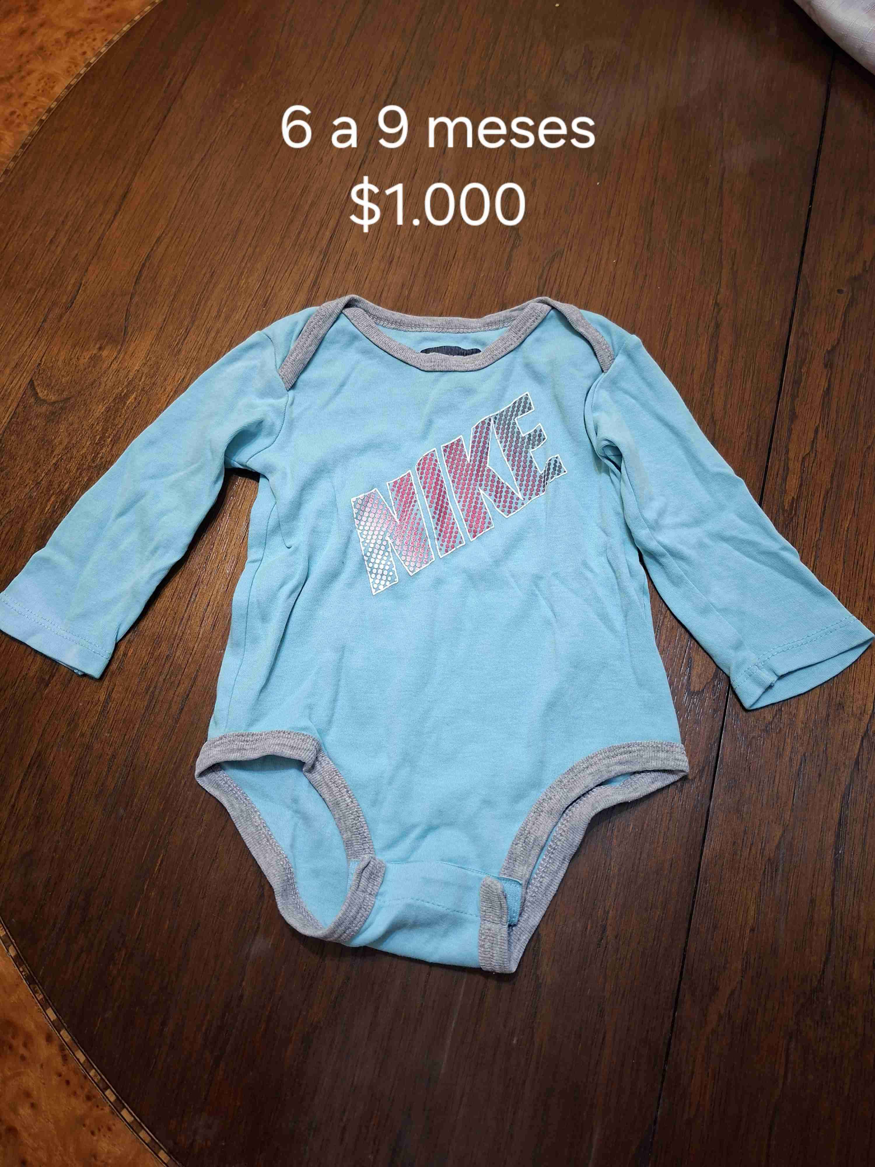 Body bebé Nike celeste