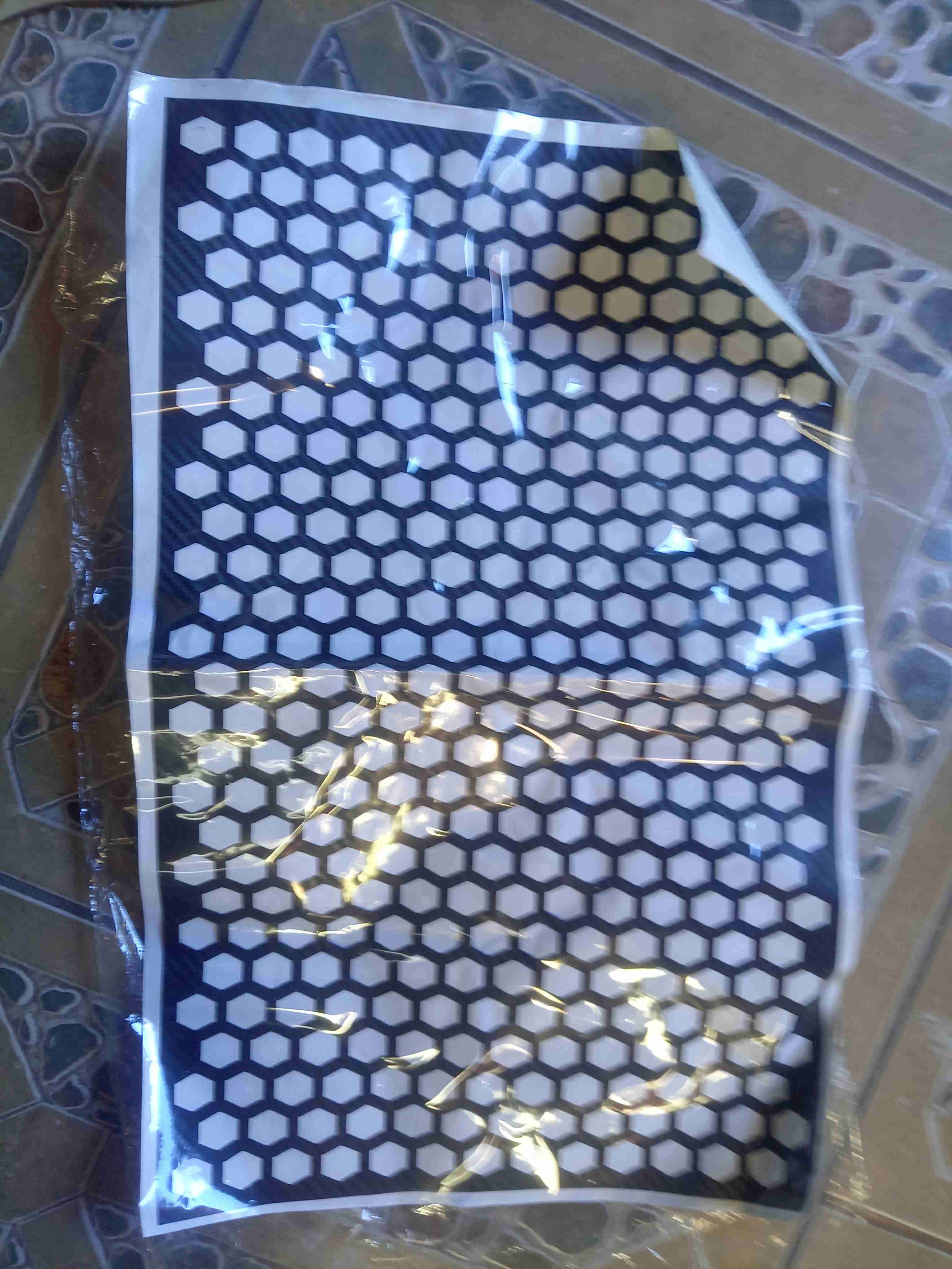 Mantel plástico hexagonal para focos de auto