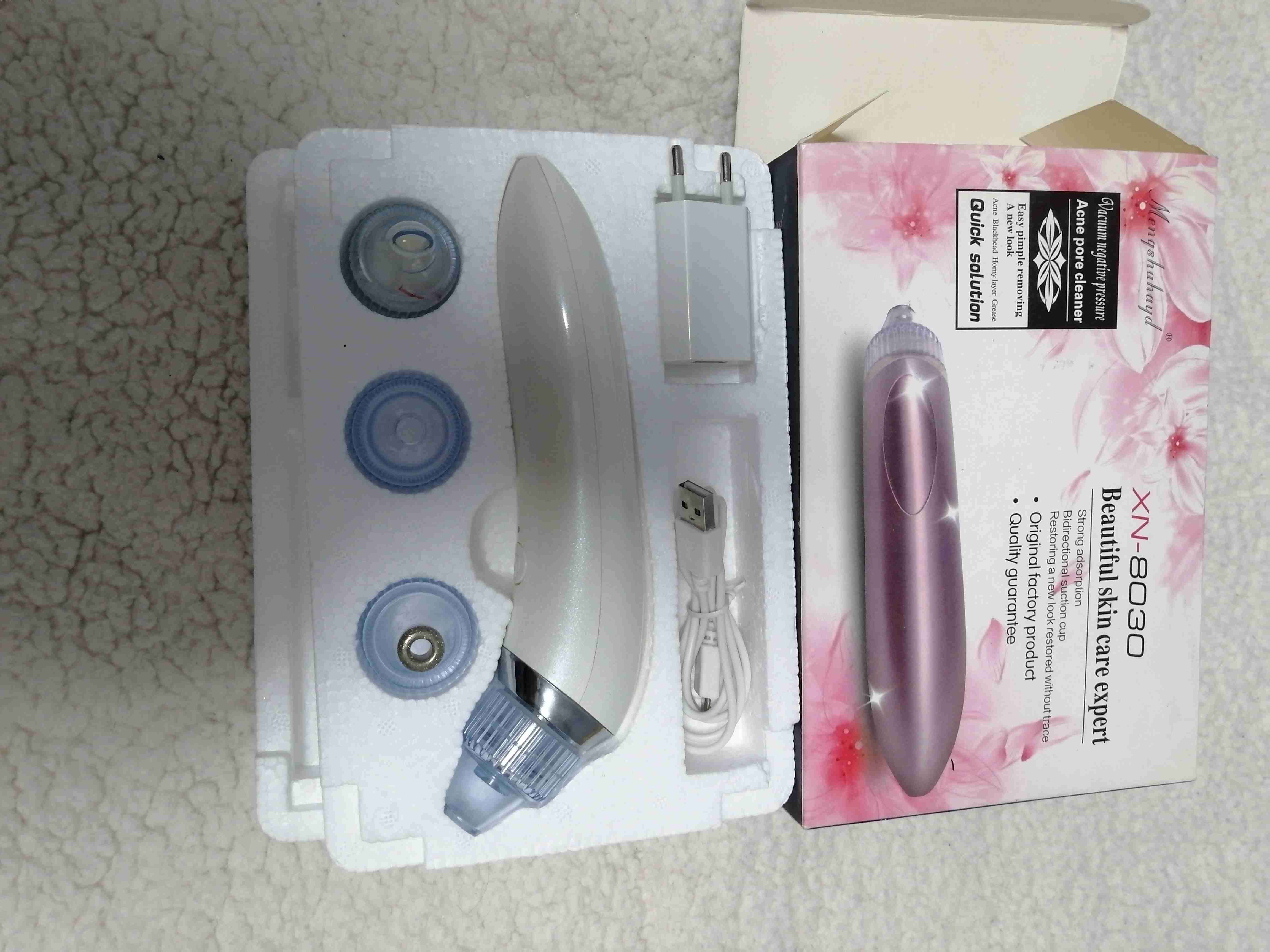 Aspirador facial eléctrico