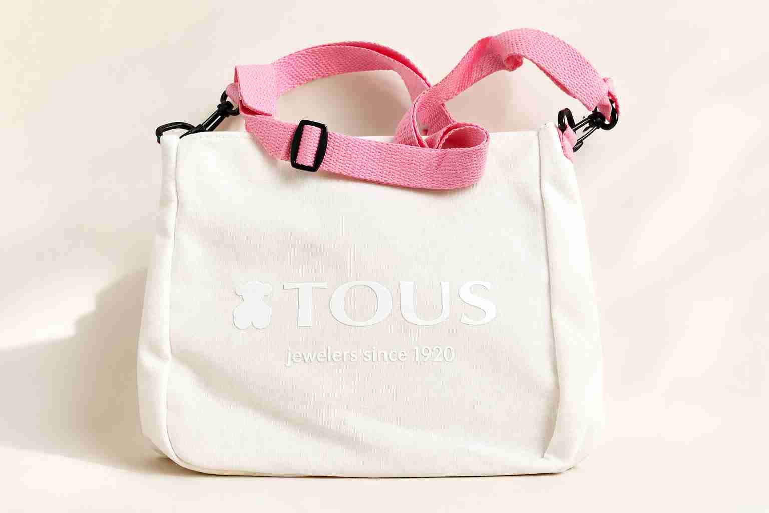 Bolso blanco alta gama con correa rosa