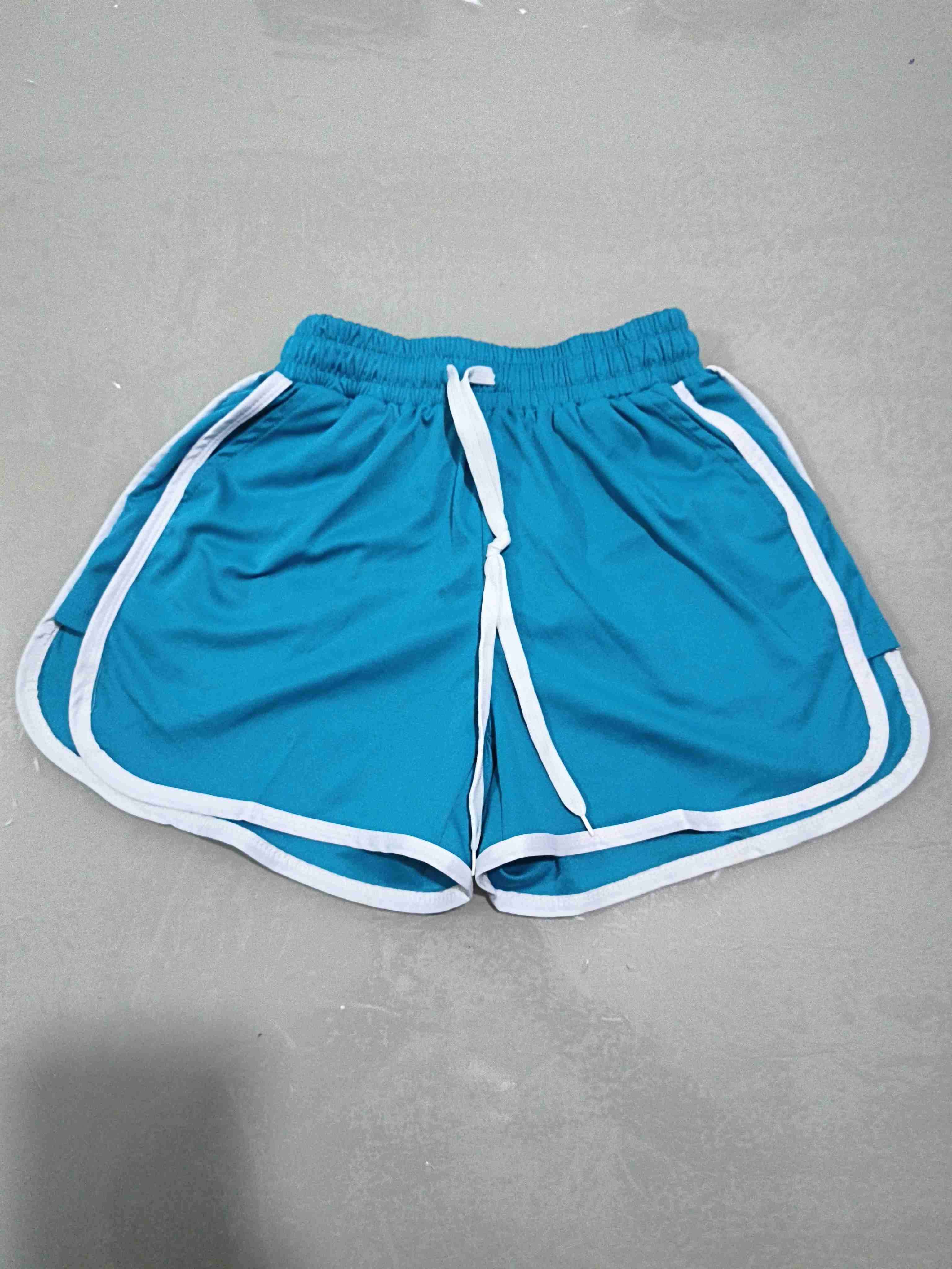 Shorts deportivos azules con borde blanco para muj - miniatura 1