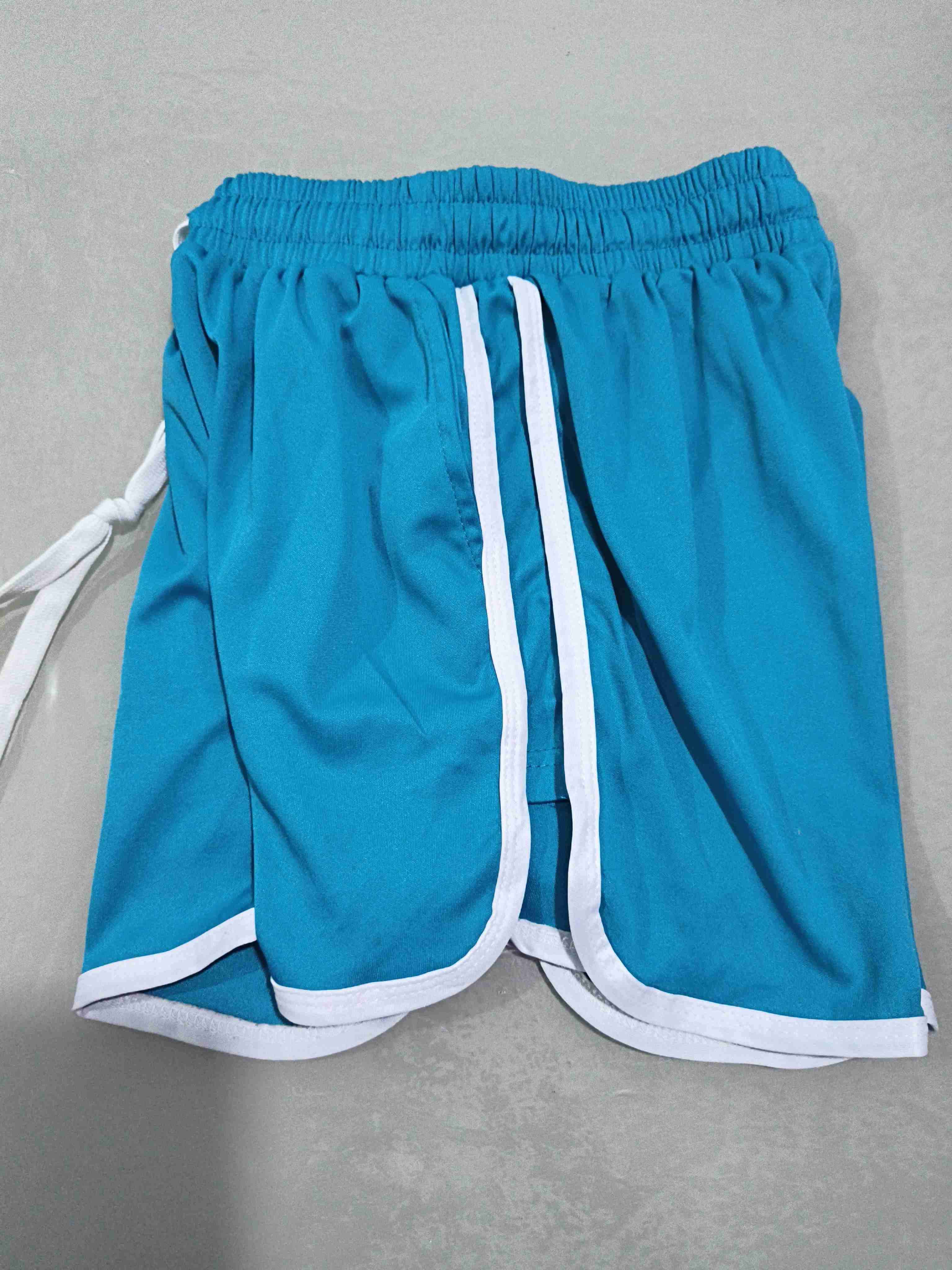 Shorts deportivos azules con borde blanco para muj - miniatura 6