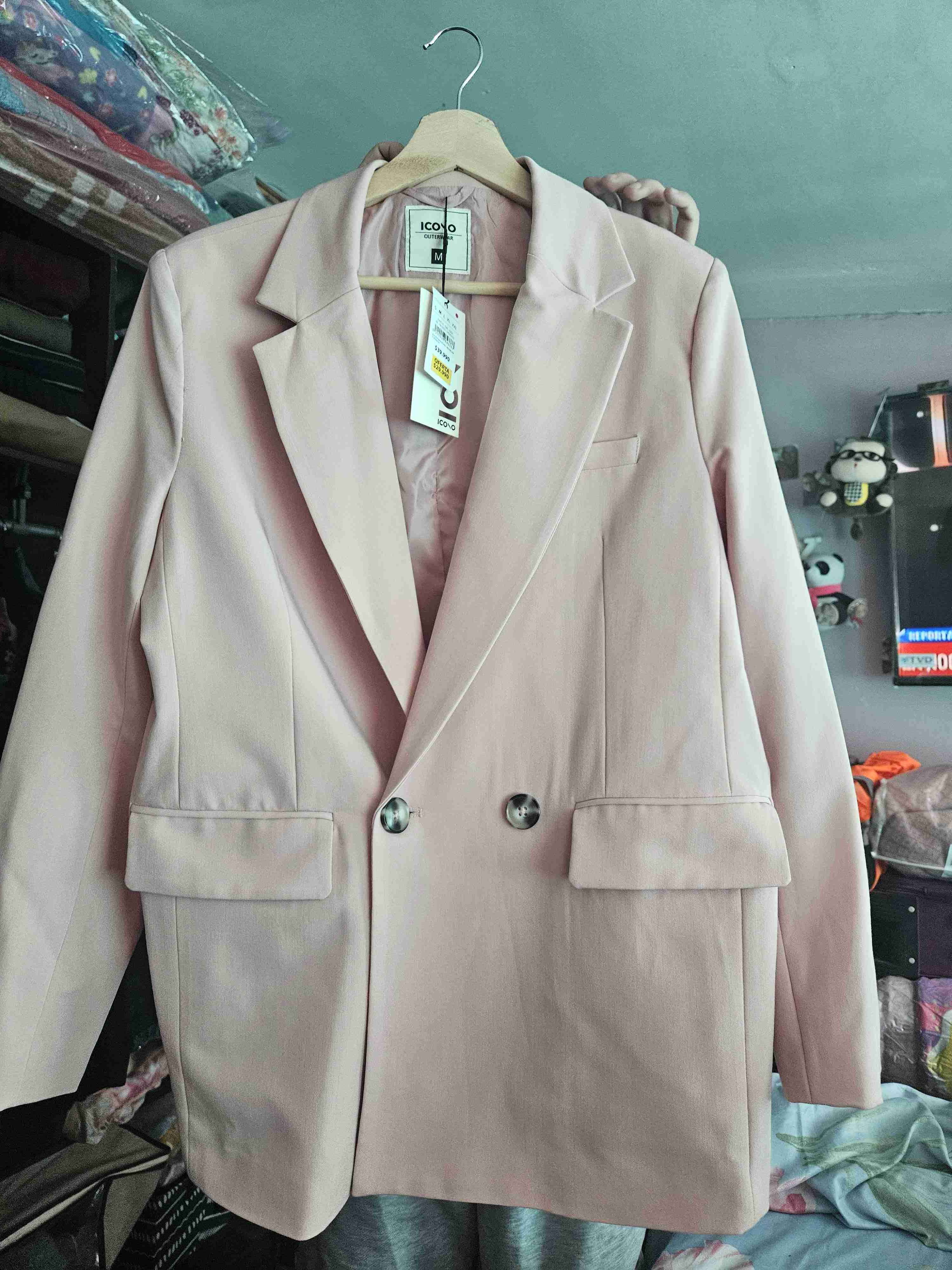 Blazer rosa claro con etiqueta