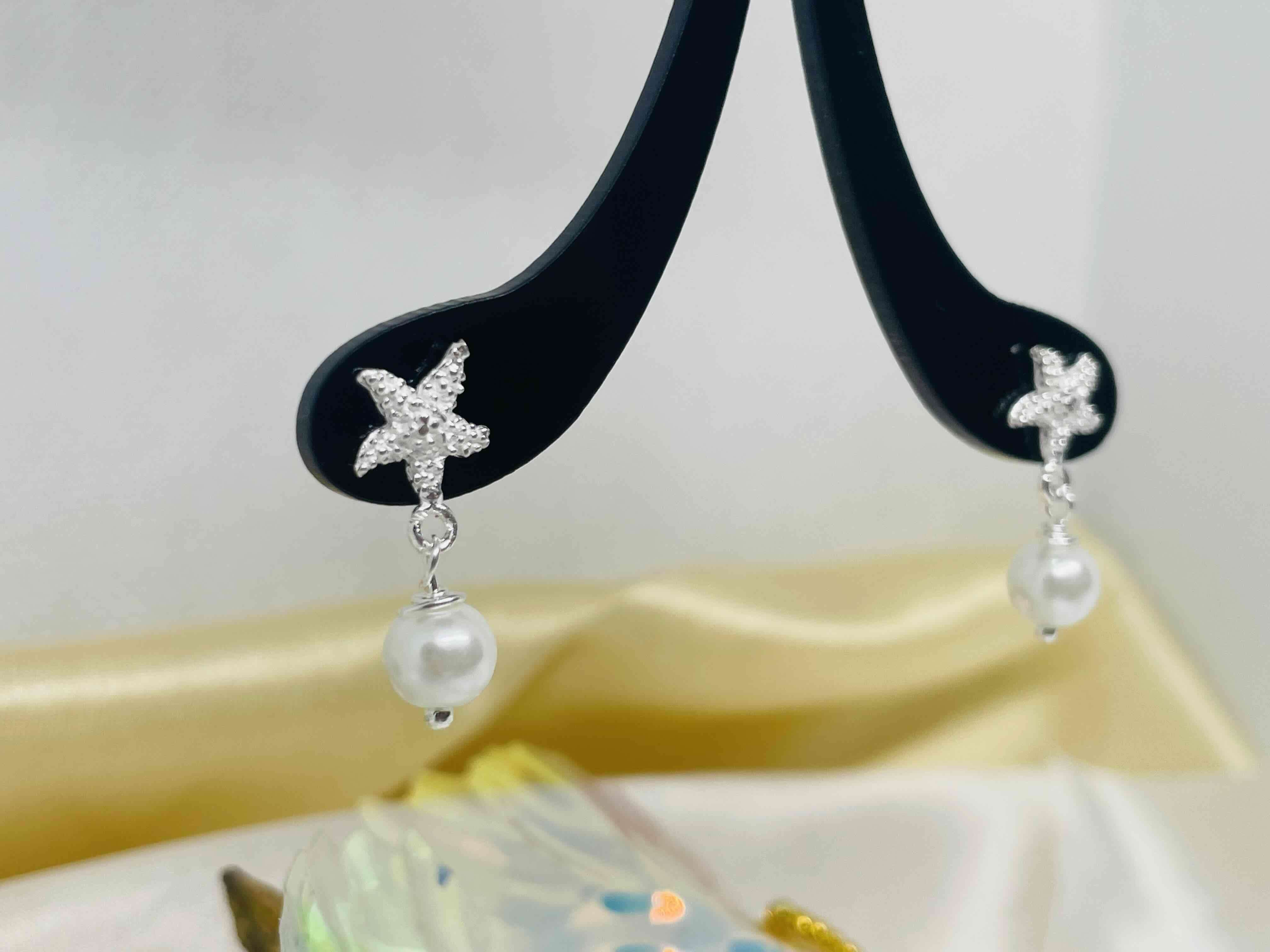 Aros colgantes estrella y perla