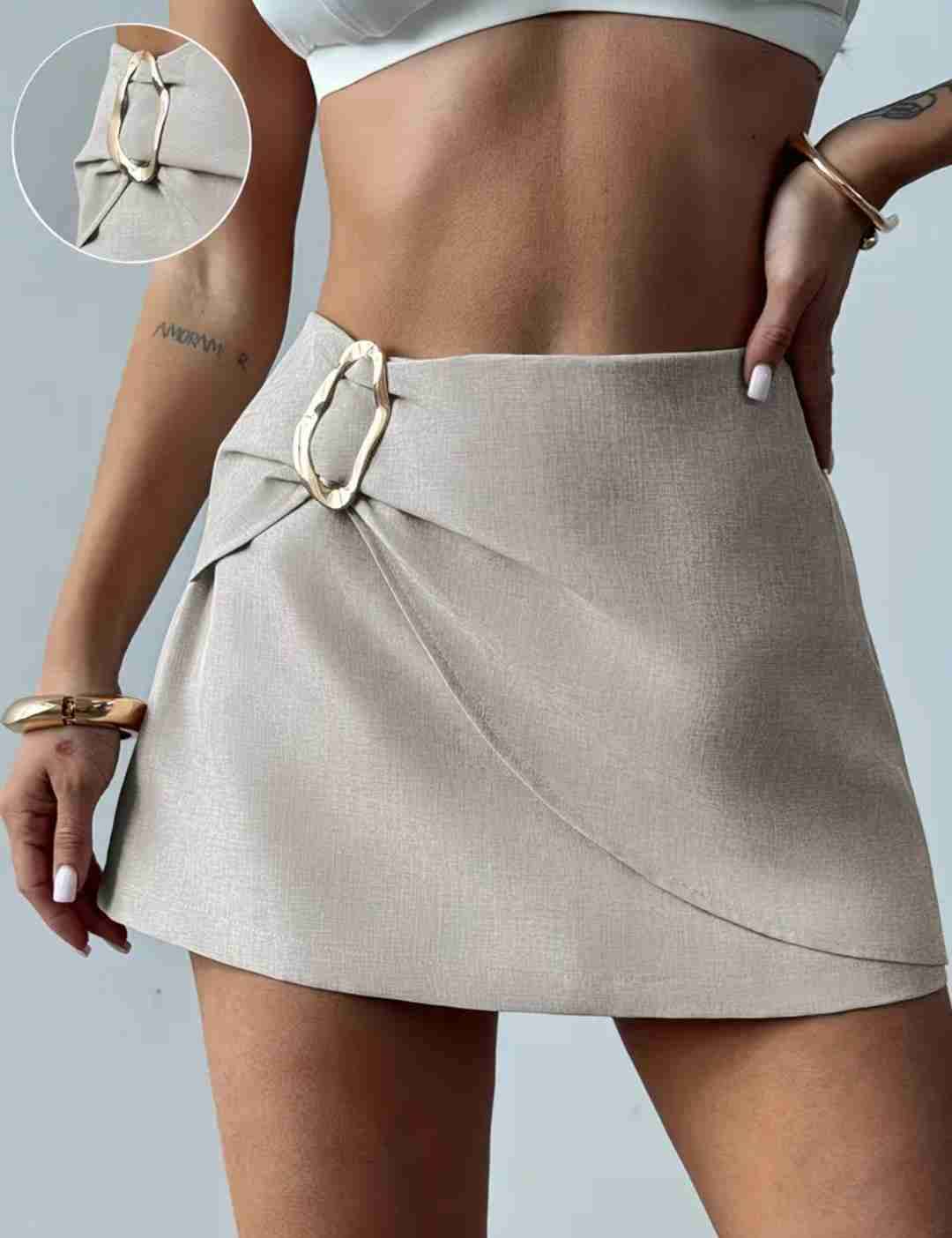 Mini falda beige elegante - miniatura 1