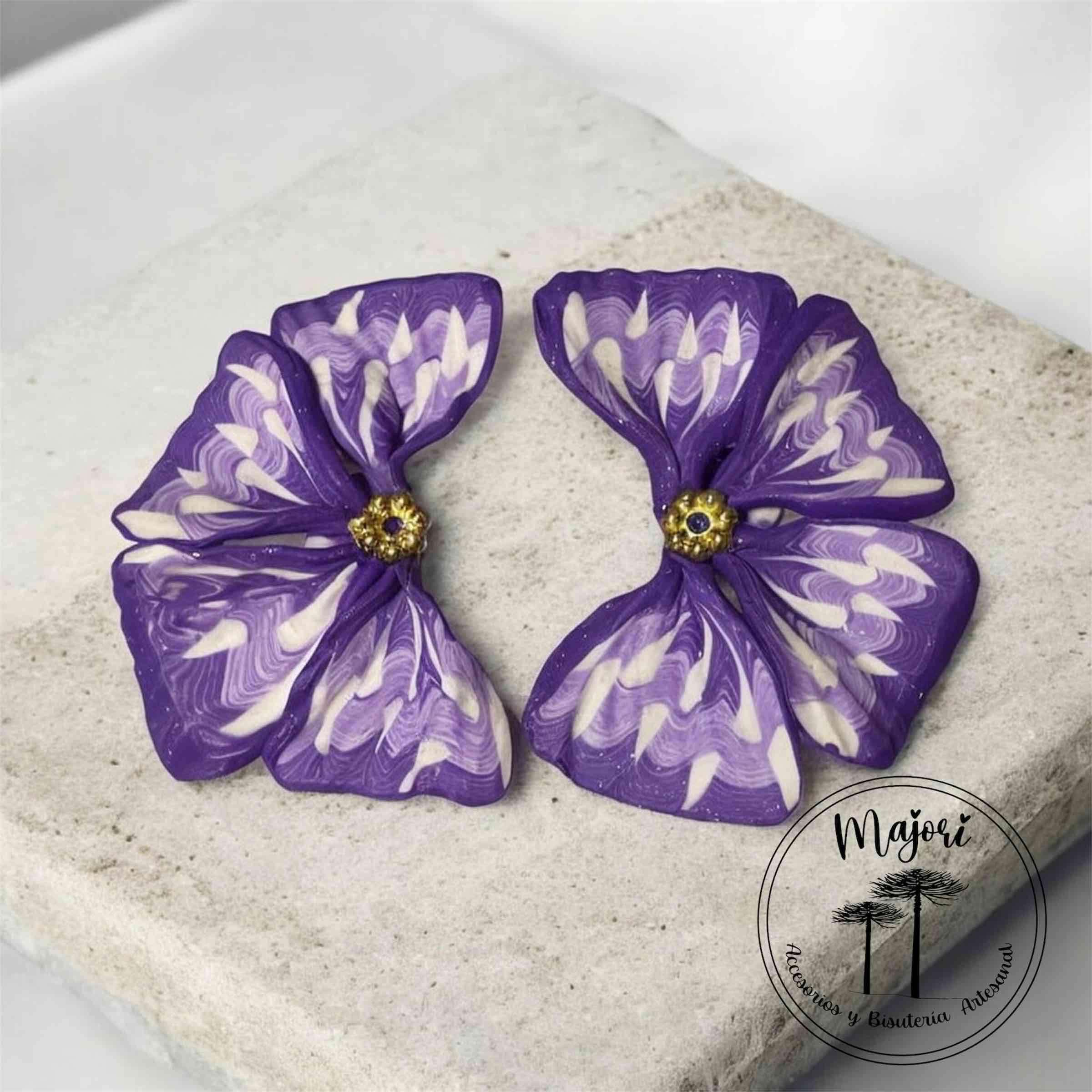 Aros de arcilla polimerica  morados con diseño