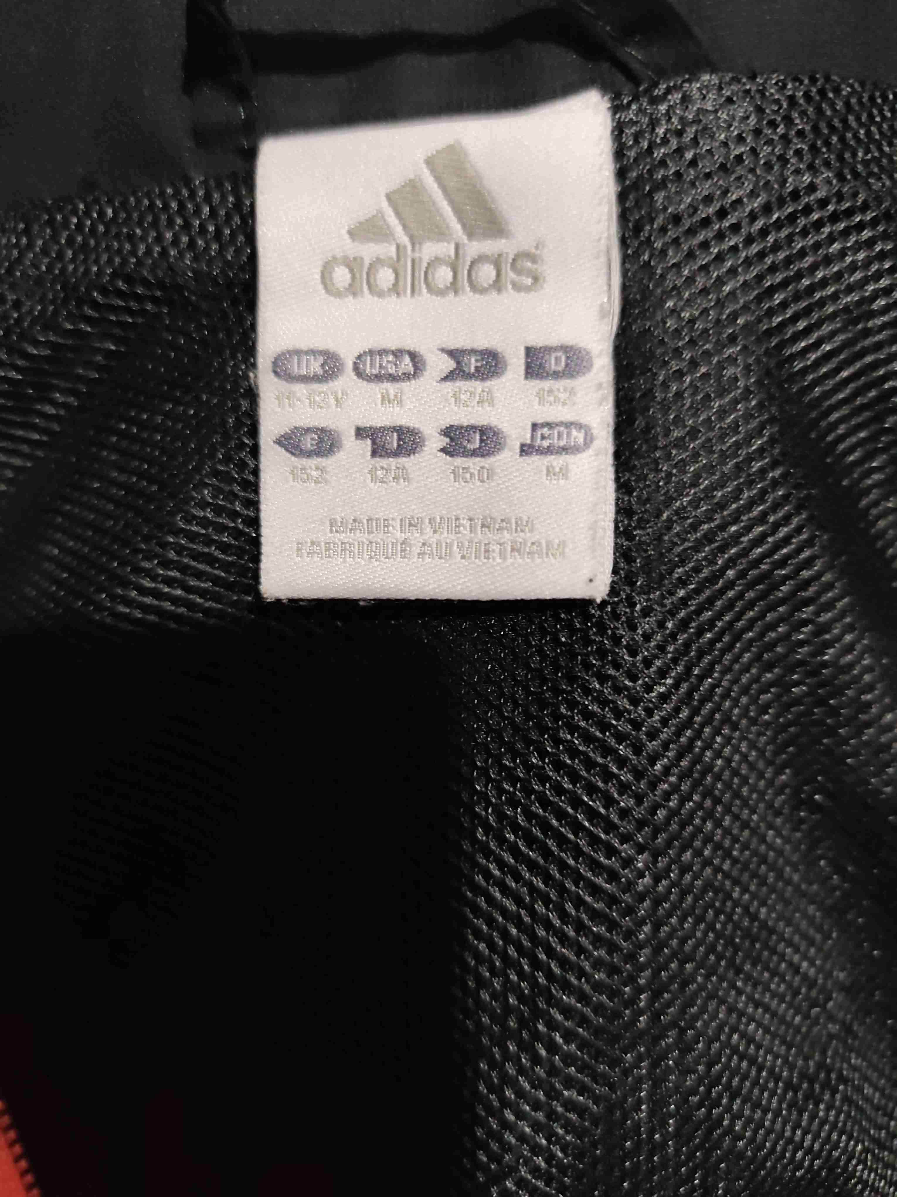 Chaqueta negra con detalles naranjas - miniatura 2