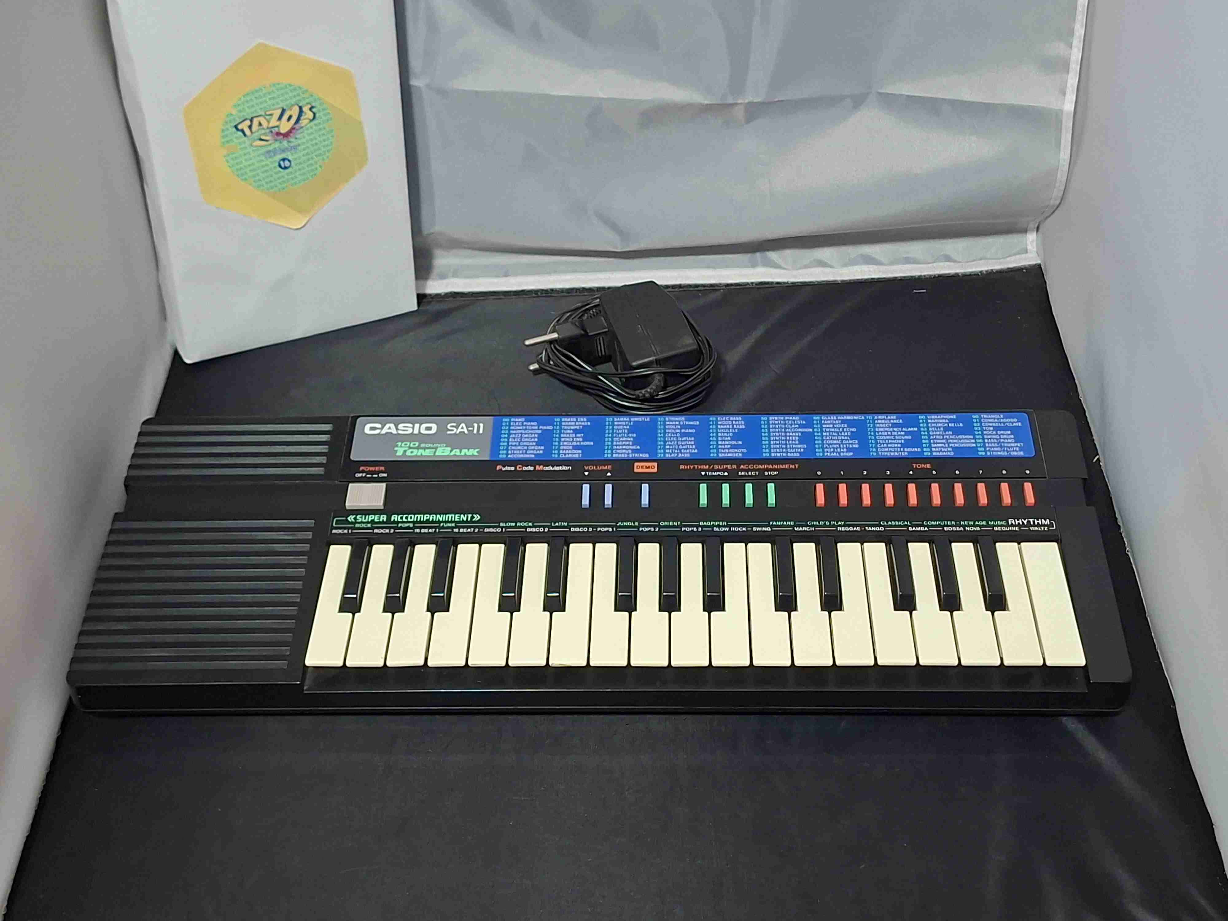 Teclado Casio SA-11 con adaptador - miniatura 1