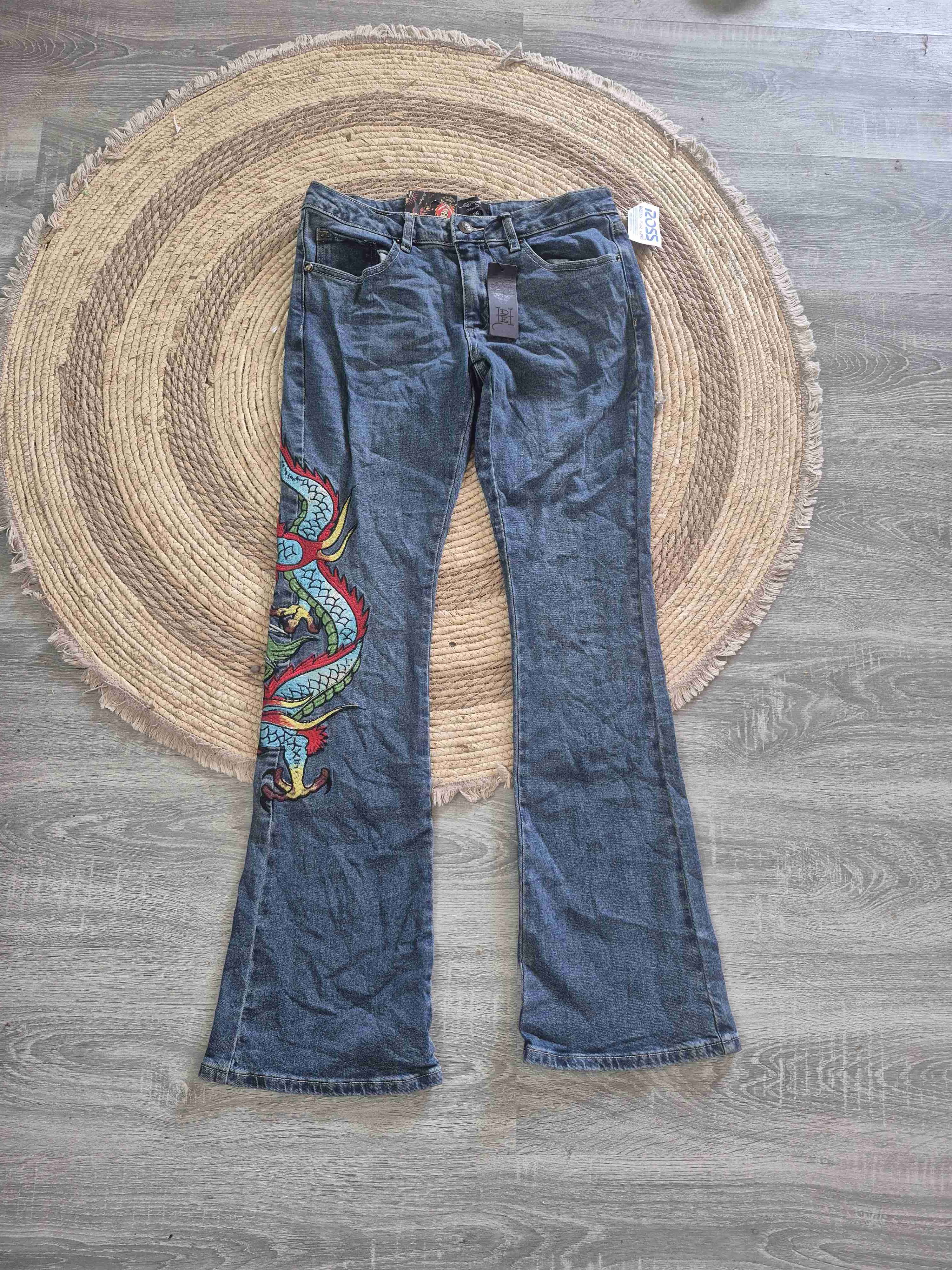 Jeans con diseño de dragón - miniatura 1