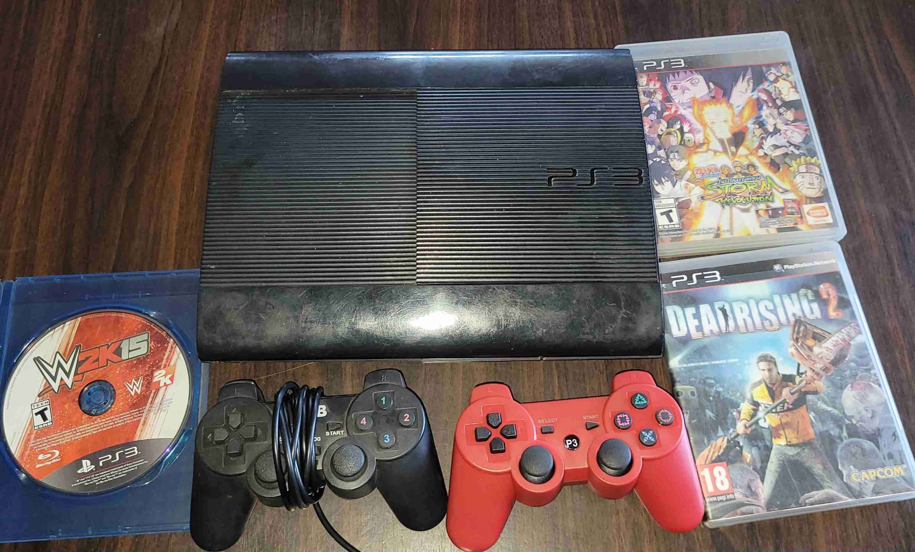 Consola PS3 con juegos y controles - miniatura 2