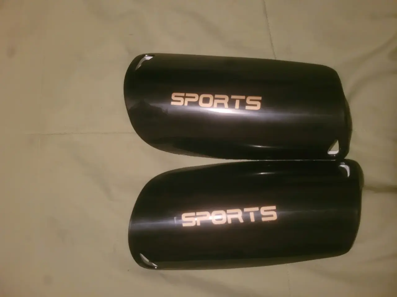 Canilleras deportivas negras - miniatura 1