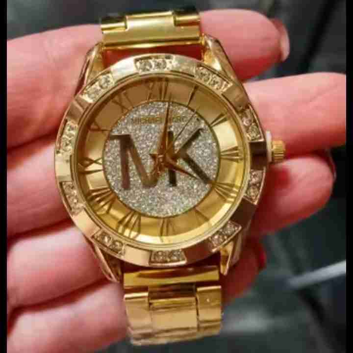 Reloj dorado con diseño brillante - miniatura 1