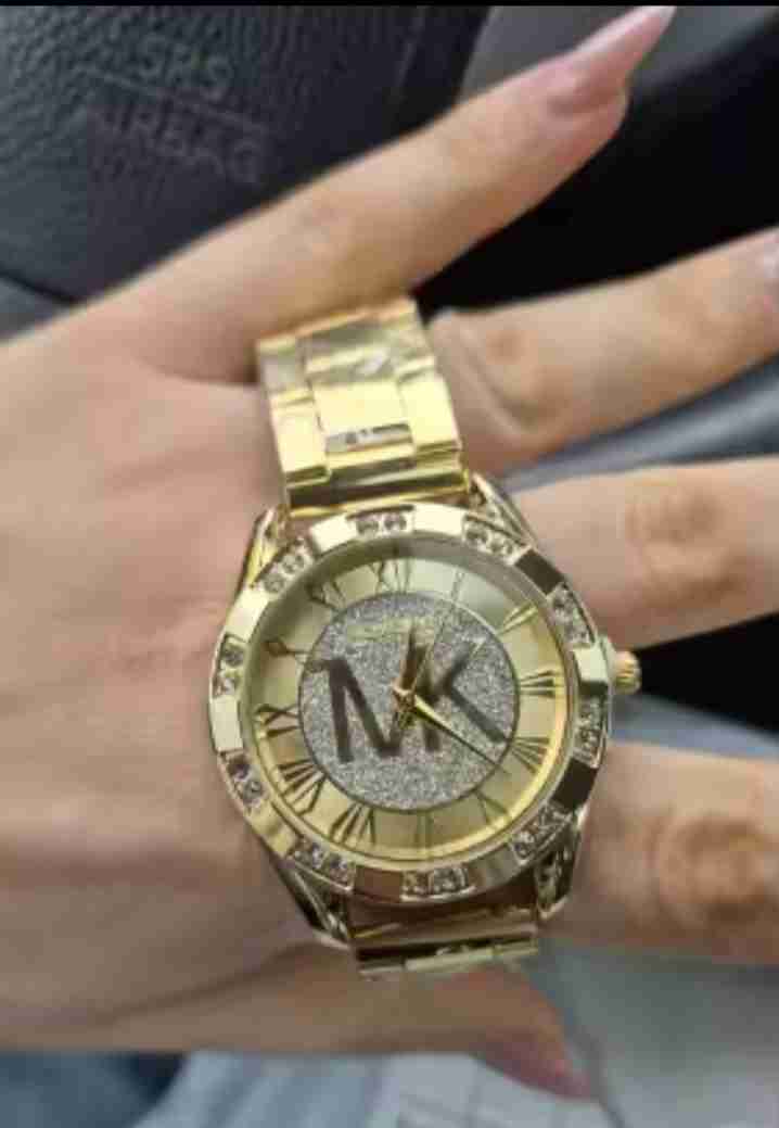 Reloj dorado con diseño brillante - miniatura 2