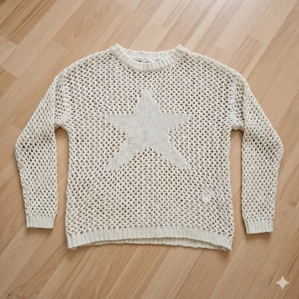 Suéter beige tejido con estrella