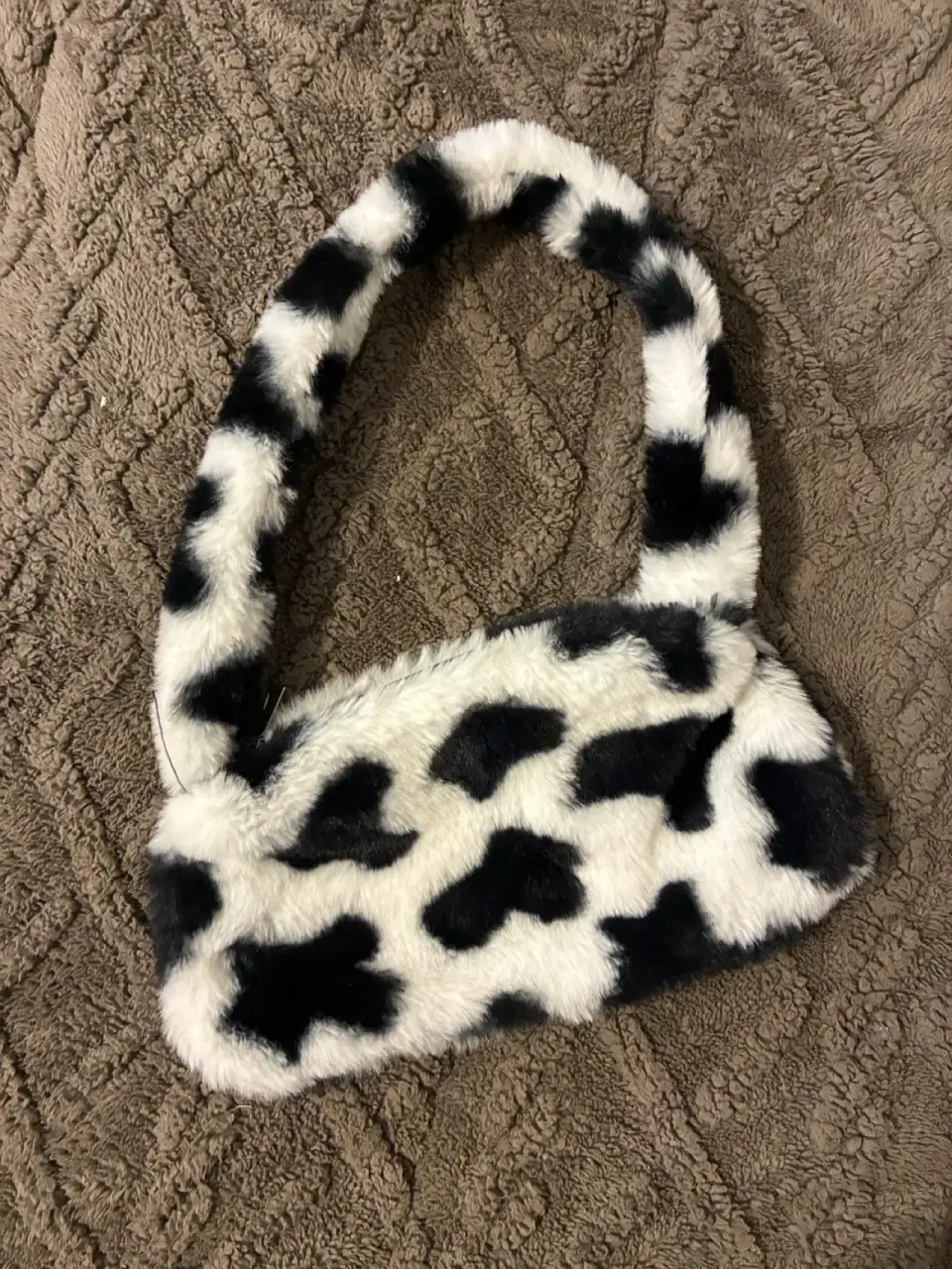 Cartera mini peluda de vaca