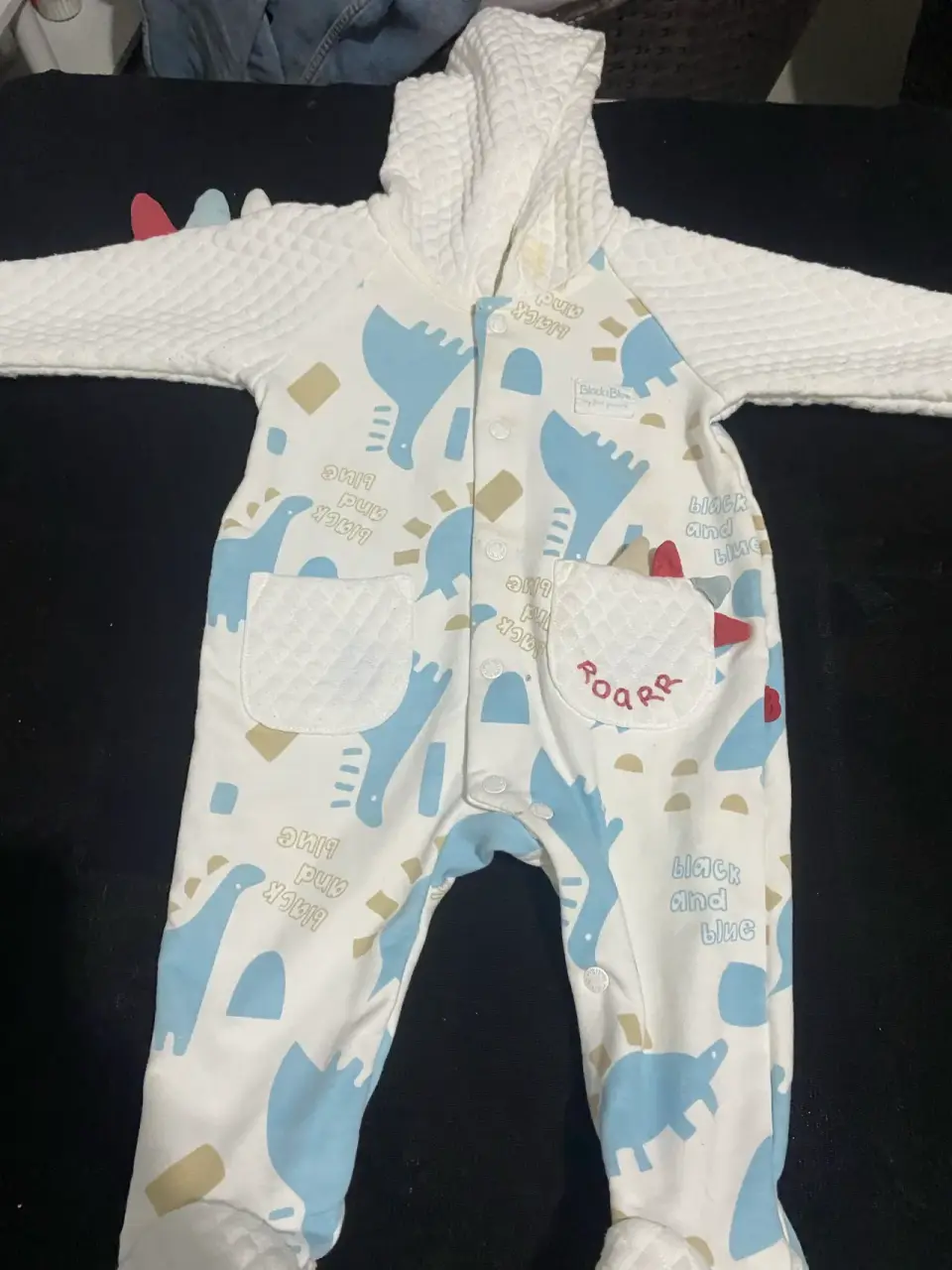 Enterito de bebé con dinosaurios