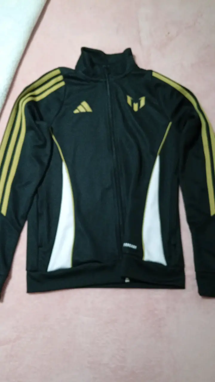 Chaqueta deportiva negra y dorada - miniatura 1