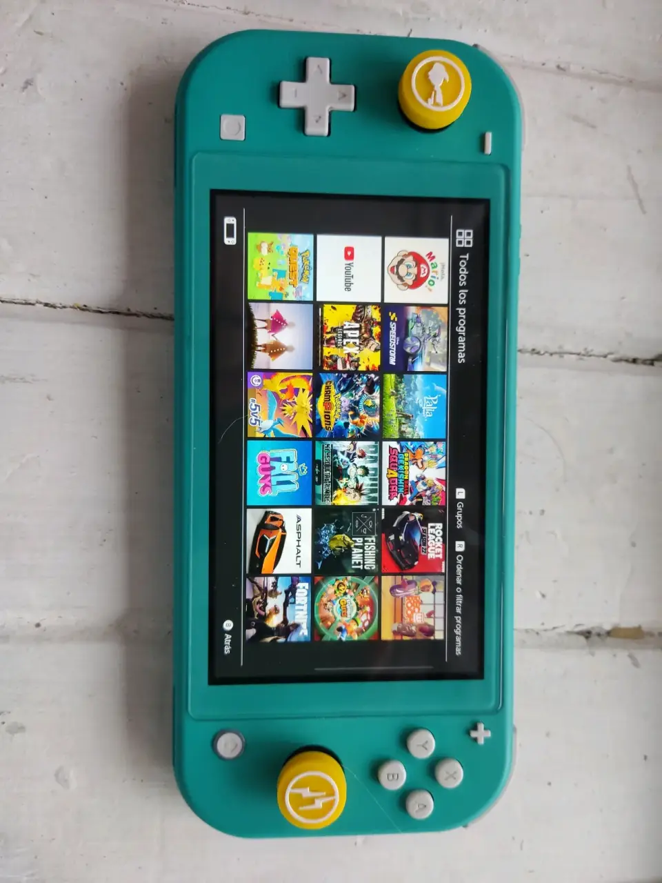 Nintendo switch lite turquesa con extras - miniatura 2
