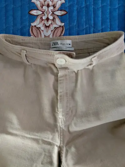 Pantalones beige acampanados - miniatura 2