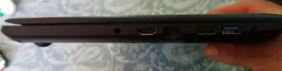 Laptop Lenovo con mouse inalámbrico y cargador. - miniatura 6