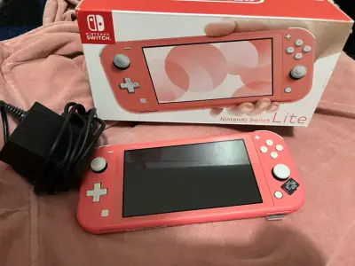 Nintendo Switch Lite coral - miniatura 1