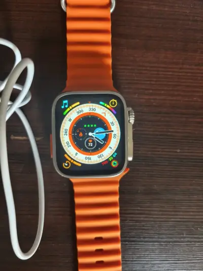 Reloj inteligente naranja con cargador - miniatura 2