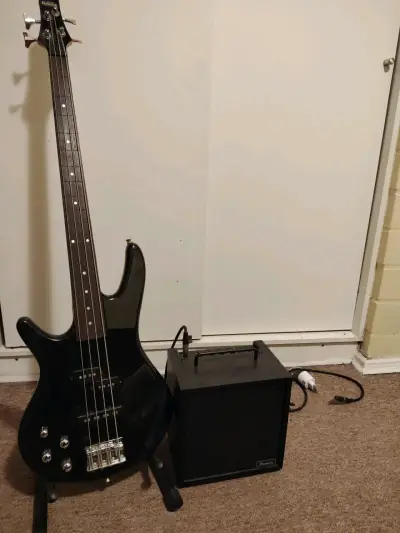 Bajo eléctrico negro con amplificador - miniatura 1