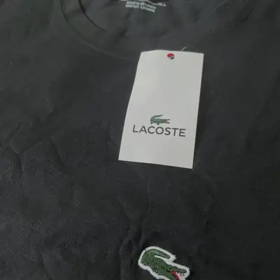 Polera negra Lacoste etiqueta - miniatura 3