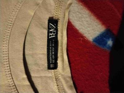 Blusa beige con volantes - miniatura 2