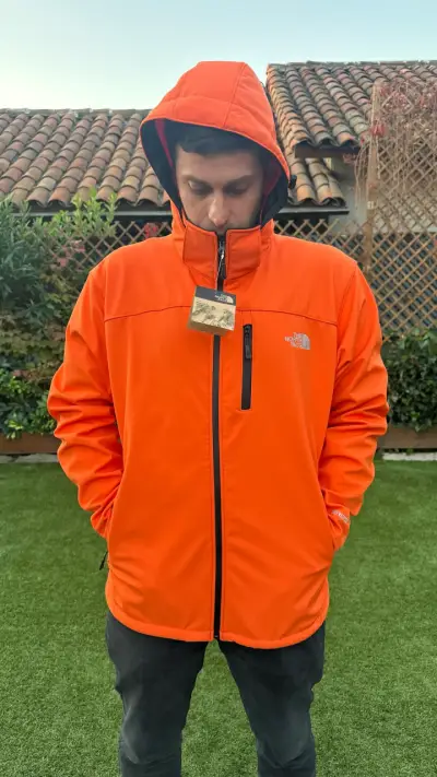 Chaqueta naranja impermeable northface - miniatura 1