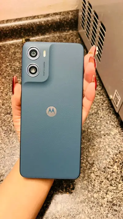 Teléfono móvil azul usado - miniatura 3