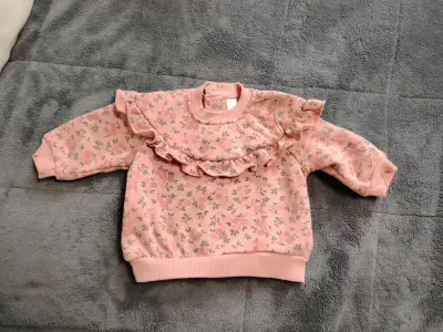 Polerón rosa con volantes para niña - miniatura 1