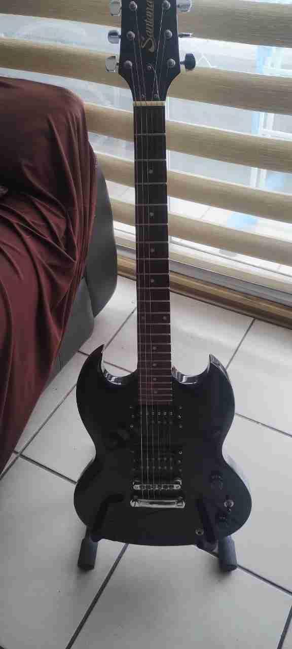 Guitarra Santana con amplificador - 1