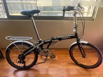 Vendo bicicleta trinx plegable en buen estado. - miniatura 1