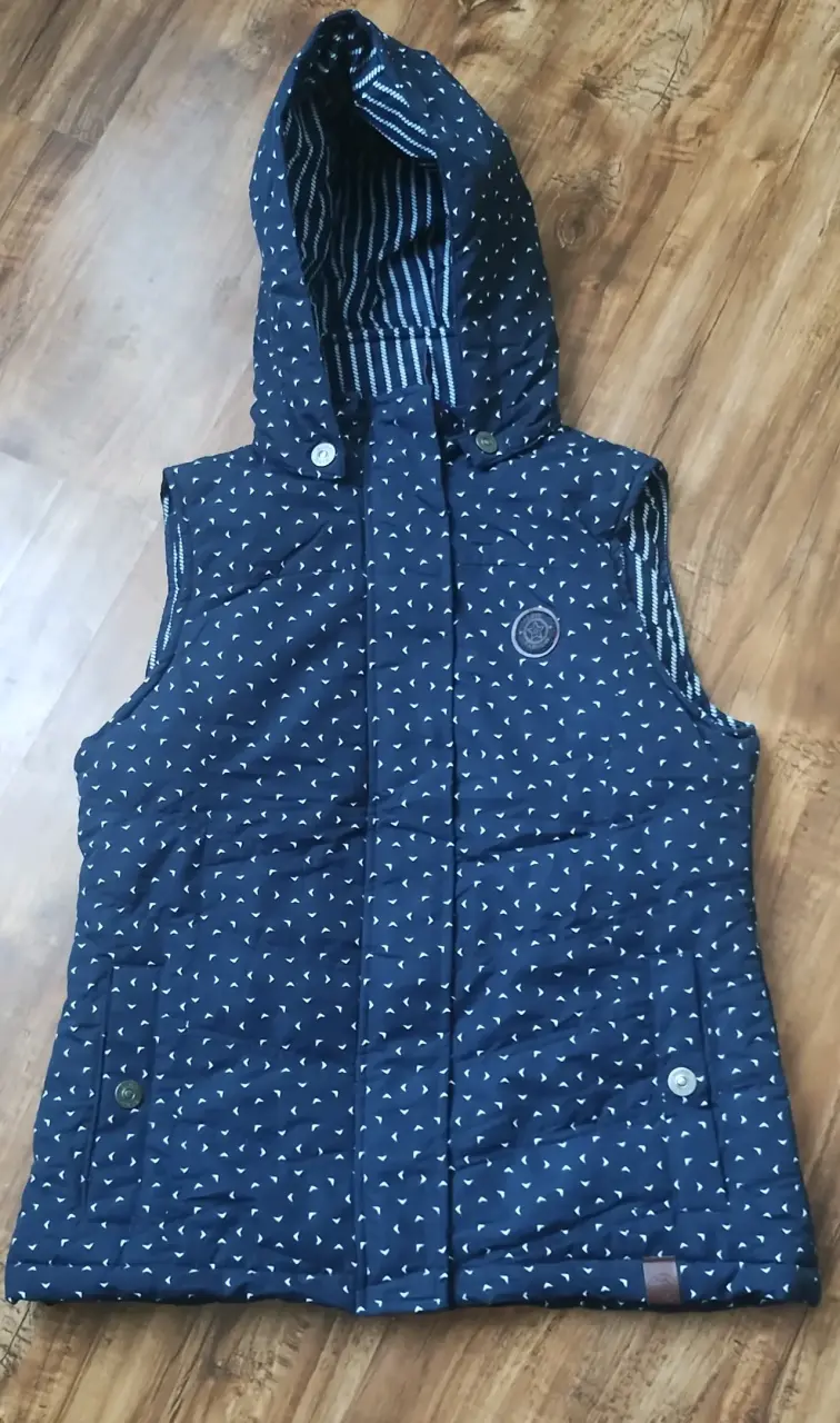 Chaleco acolchado azul con capucha