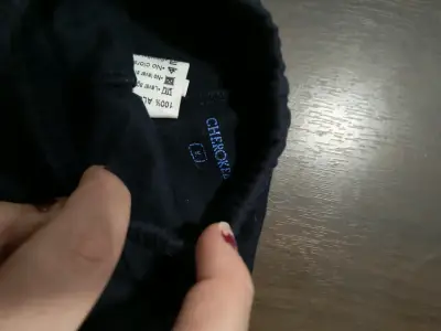 Pantalón de bebé negro con pies - miniatura 3