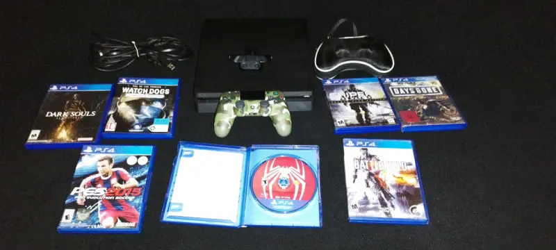 Consola PS4 con juegos incluidos y accesorios. - 1