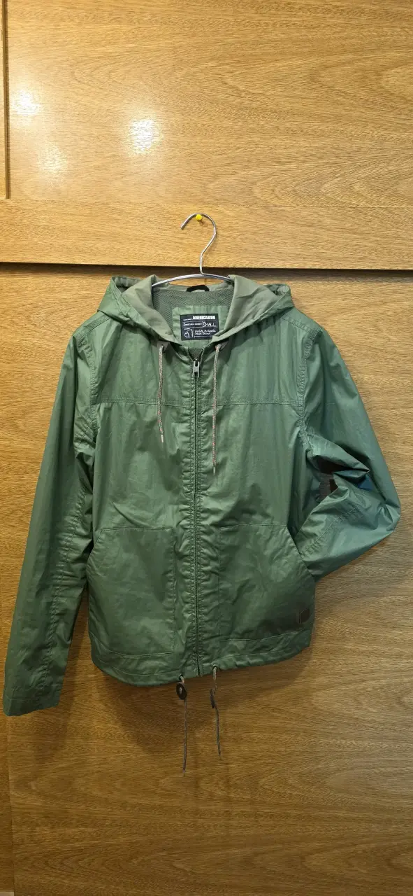 Chaqueta verde con capucha - 1