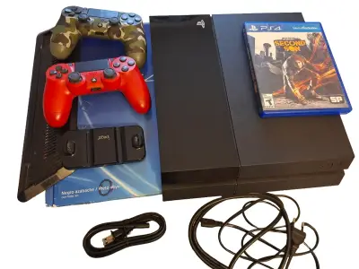 Consola PS4 con accesorios y 2 juegos - miniatura 1