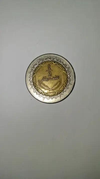 Moneda antigua 1/2 dinar Libio - miniatura 1