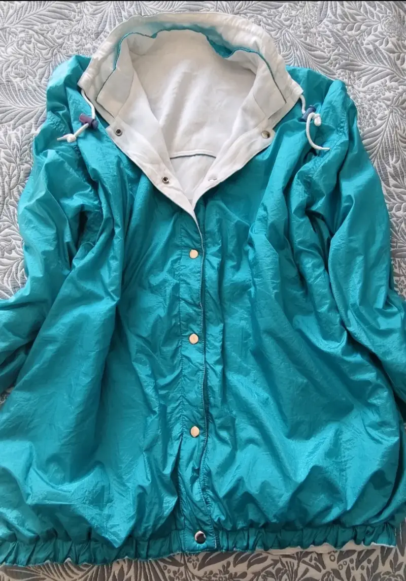 Chaqueta cortaviento turquesa unisex