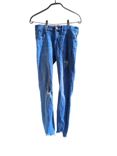 Jeans azules con estilo rasgado - miniatura 1