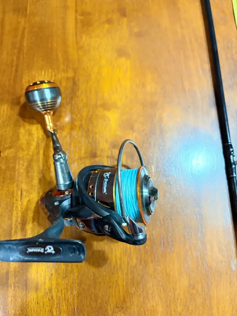 Carrete de pesca y caña botera de spinning - 1