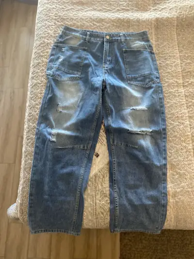 Jeans de mezclilla azul gastados - miniatura 2