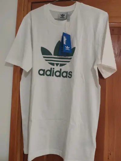 Polera blanca Adidas con logo verde - miniatura 1