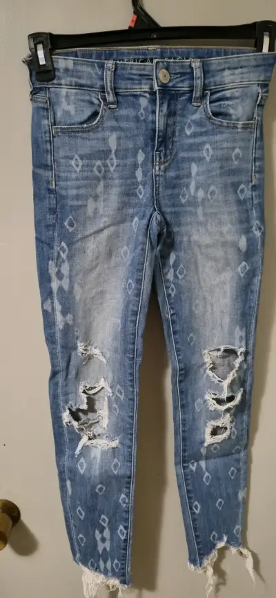 Jeans desgastados azul con patrón - miniatura 1