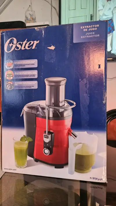 Extractor de jugo Oster rojo - miniatura 1