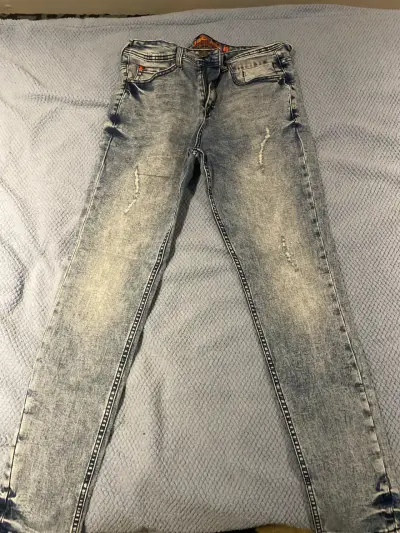 Jeans desgastados azul claro - miniatura 1